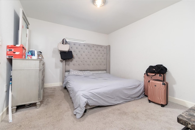 carpeted bedroom with baseboards