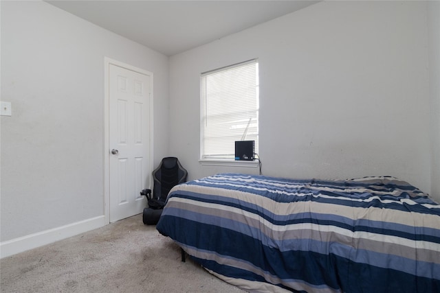 carpeted bedroom with baseboards