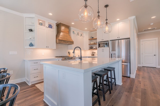 kitchen with open shelves, stainless steel appliances, light countertops, visible vents, and premium range hood