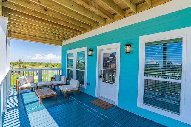 deck featuring outdoor lounge area