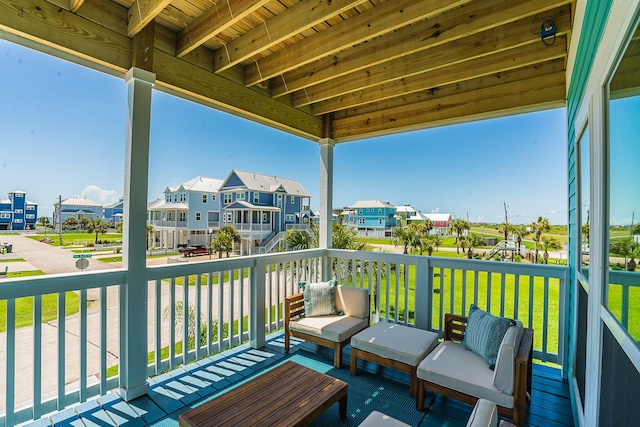 wooden terrace with a residential view