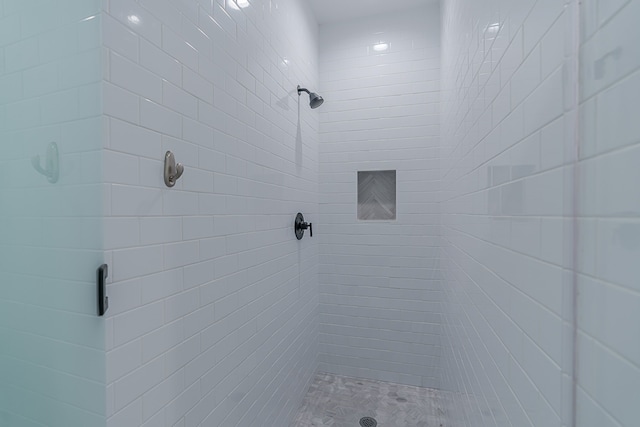 full bath featuring a shower stall