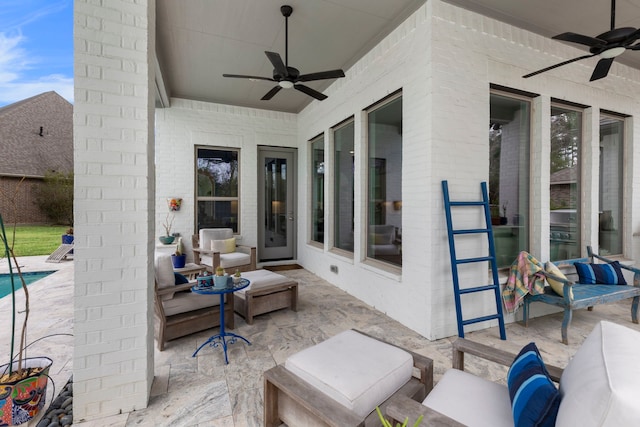 view of patio featuring an outdoor living space, a ceiling fan, and an outdoor pool