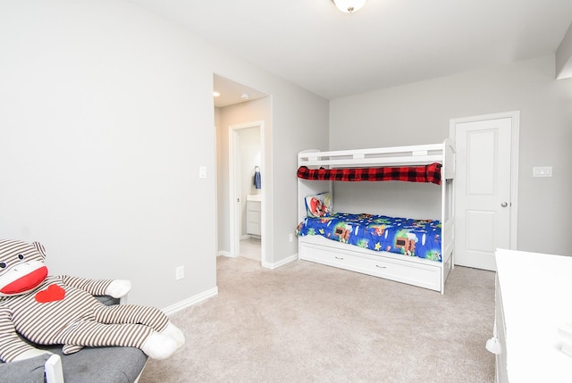 bedroom with baseboards and carpet flooring