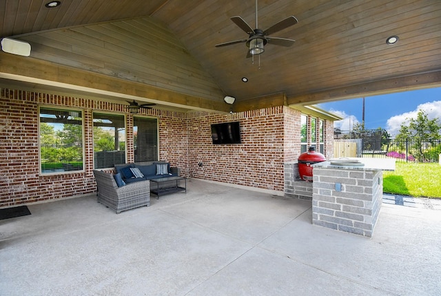 view of patio with a ceiling fan, fence, and an outdoor living space