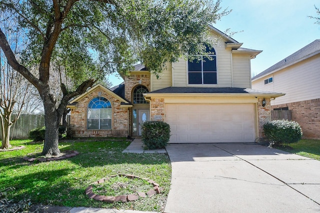 traditional-style home featuring brick siding, fence, a garage, driveway, and a front lawn