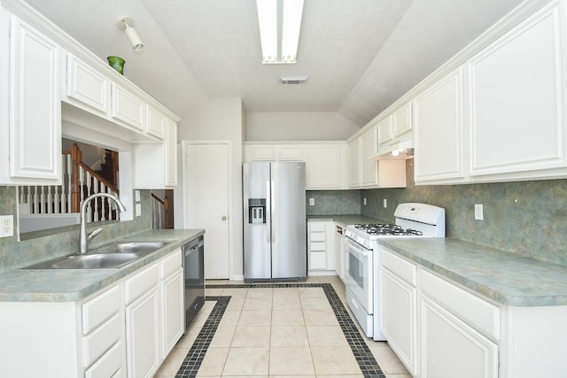 kitchen with tasteful backsplash, visible vents, appliances with stainless steel finishes, white cabinetry, and a sink