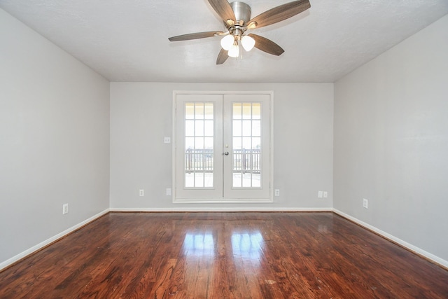 spare room featuring ceiling fan, french doors, wood finished floors, and baseboards