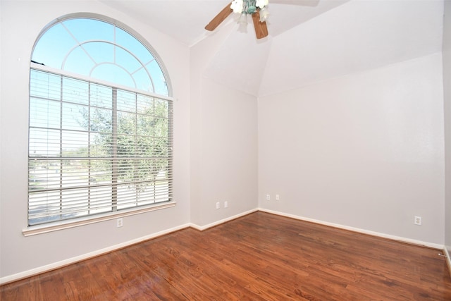 unfurnished room featuring a ceiling fan, lofted ceiling, baseboards, and wood finished floors