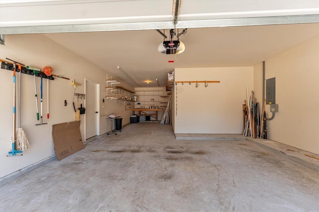 garage featuring electric panel and a garage door opener