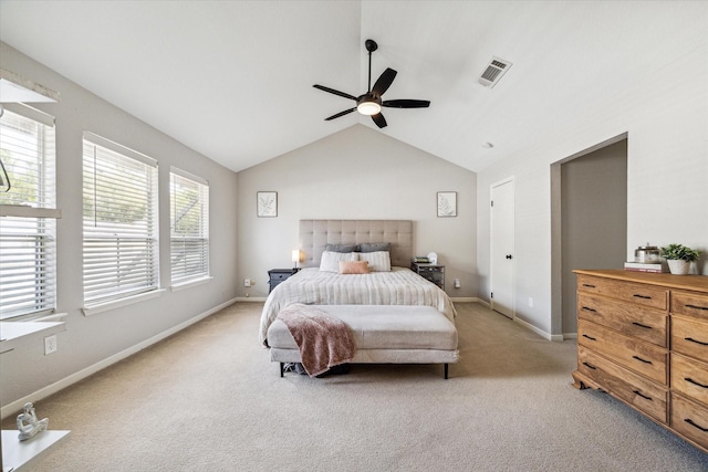 bedroom with light carpet, baseboards, visible vents, and lofted ceiling