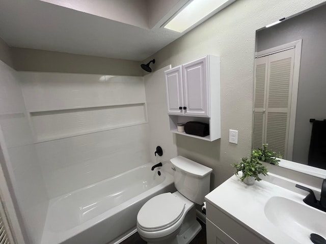 full bathroom with  shower combination, vanity, and toilet