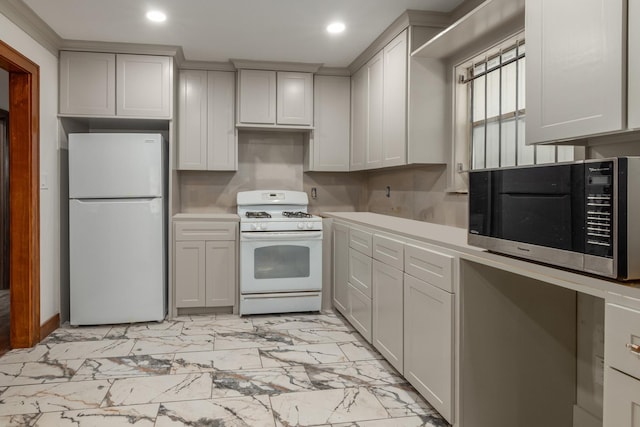 kitchen featuring white appliances, marble finish floor, light countertops, and recessed lighting