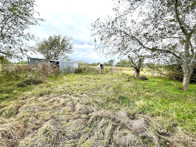 view of yard with a rural view