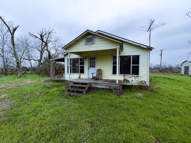 bungalow-style house with a front lawn