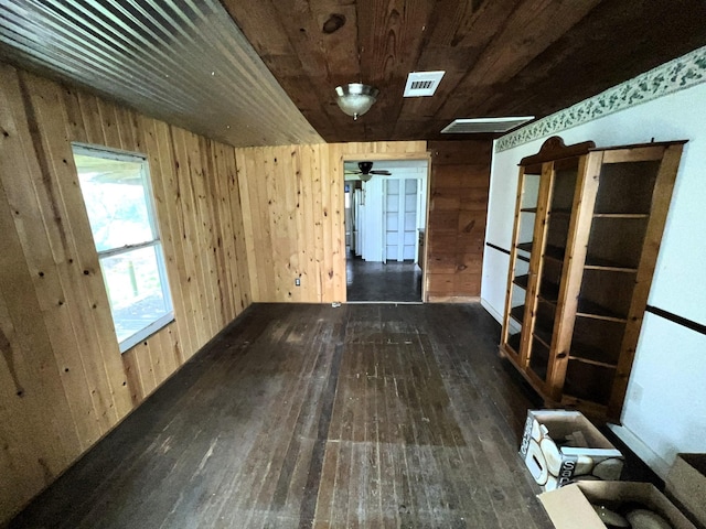 38440 Fisk Ln, Pattison, TX 77423 - unfurnished room with wood-type flooring, wood walls, and wooden ceiling