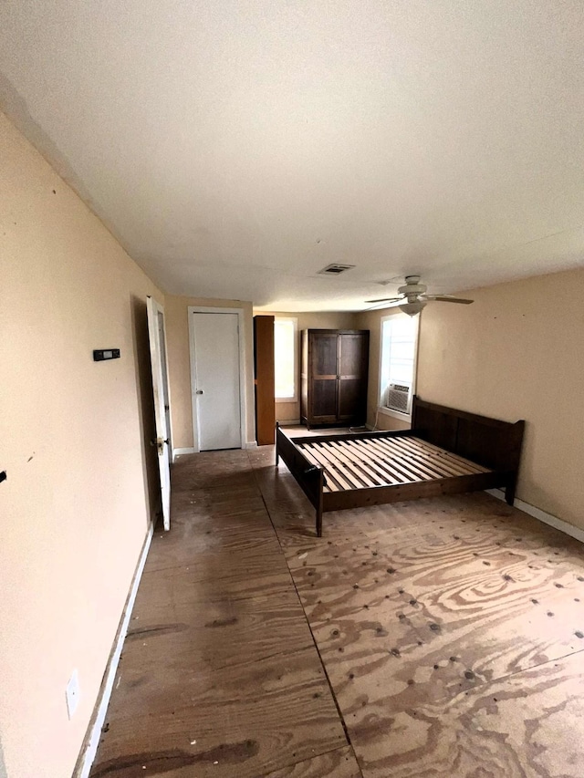 unfurnished bedroom featuring visible vents and baseboards