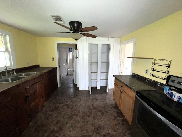 38440 Fisk Ln, Pattison, TX 77423 - kitchen featuring range with electric stovetop, dark countertops, and ceiling fan