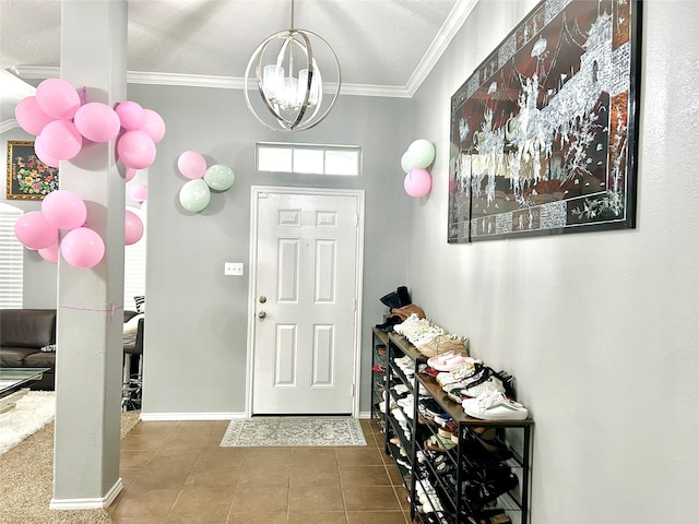 tiled entryway featuring an inviting chandelier, baseboards, and crown molding