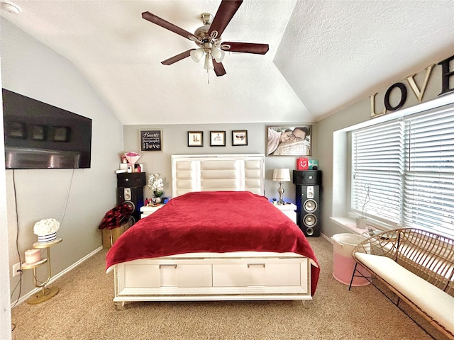 bedroom featuring carpet, lofted ceiling, a ceiling fan, a textured ceiling, and baseboards