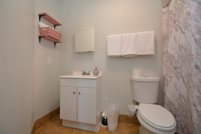 bathroom with curtained shower, toilet, vanity, baseboards, and tile patterned floors