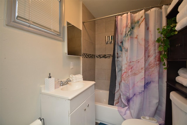 full bath featuring shower / tub combo, vanity, and toilet