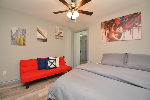 bedroom featuring a ceiling fan and wood finished floors