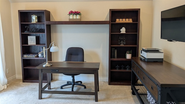 carpeted office with baseboards