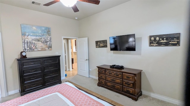 bedroom featuring visible vents, baseboards, and light colored carpet