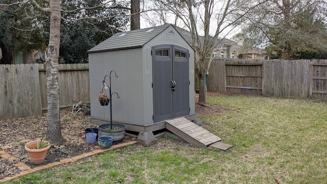 view of shed featuring a fenced backyard