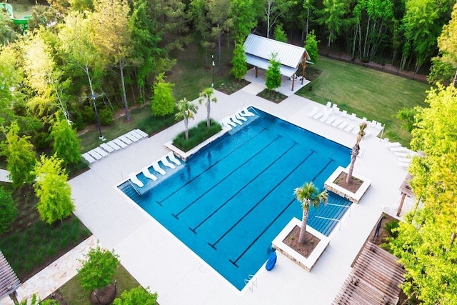 pool featuring a yard and fence