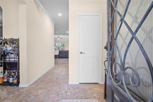 foyer featuring light tile patterned floors, ceiling fan, baseboards, and recessed lighting