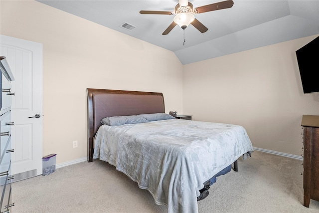 bedroom featuring lofted ceiling, light carpet, visible vents, and baseboards