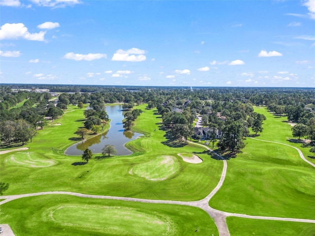 birds eye view of property with view of golf course, a water view, and a forest view