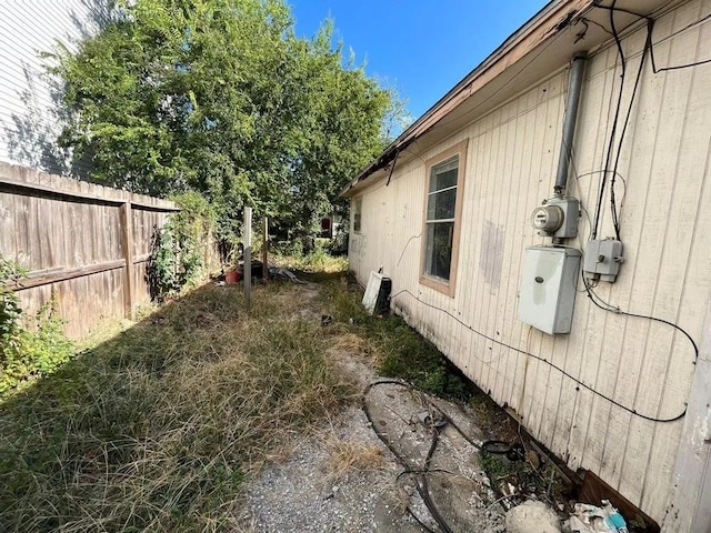 view of property exterior featuring fence