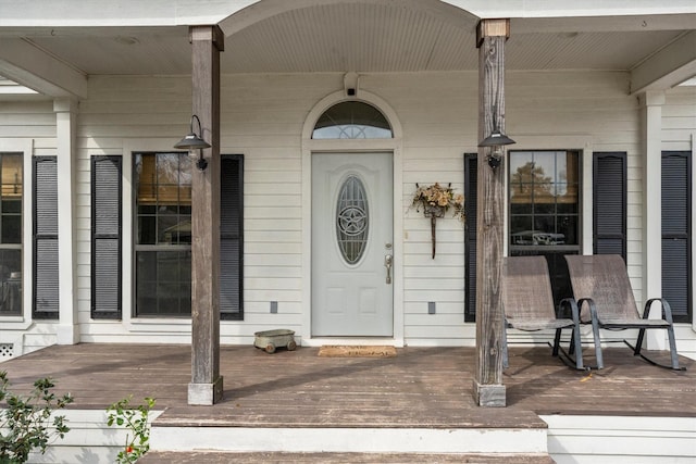 entrance to property with a porch