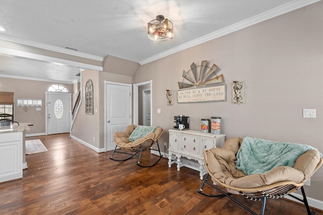 living area featuring baseboards, visible vents, dark wood finished floors, and ornamental molding