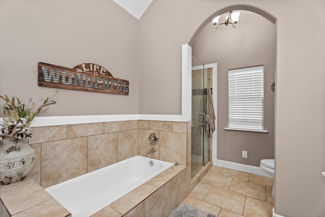 full bath featuring toilet, a notable chandelier, a shower stall, a bath, and tile patterned floors