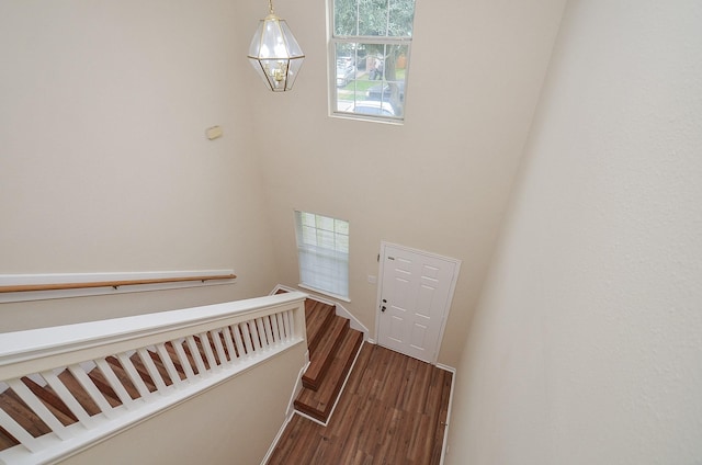 stairs featuring visible vents and wood finished floors