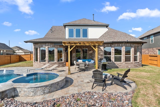 rear view of property featuring a patio, a fenced backyard, brick siding, a shingled roof, and an outdoor living space with a fire pit