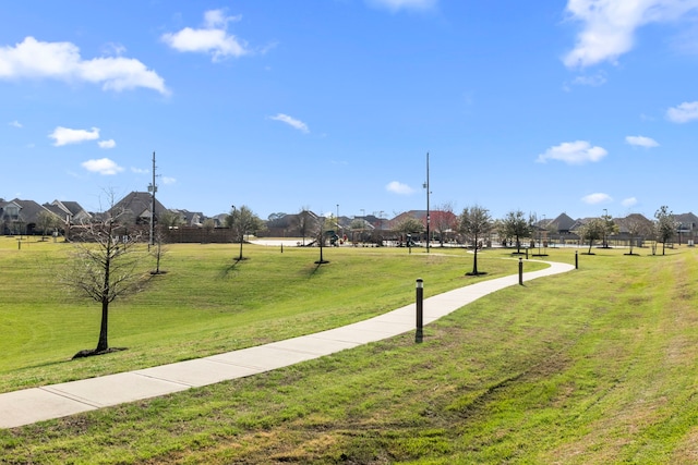 view of home's community featuring a lawn