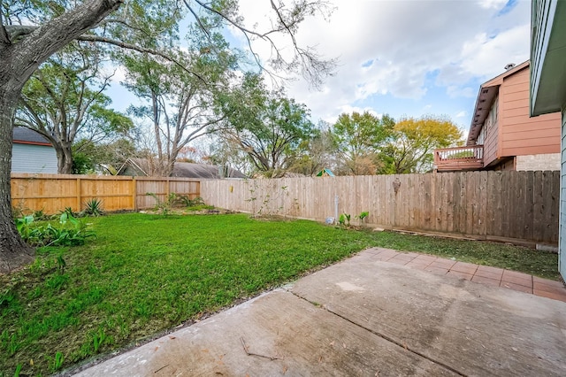 view of yard featuring a patio area and a fenced backyard