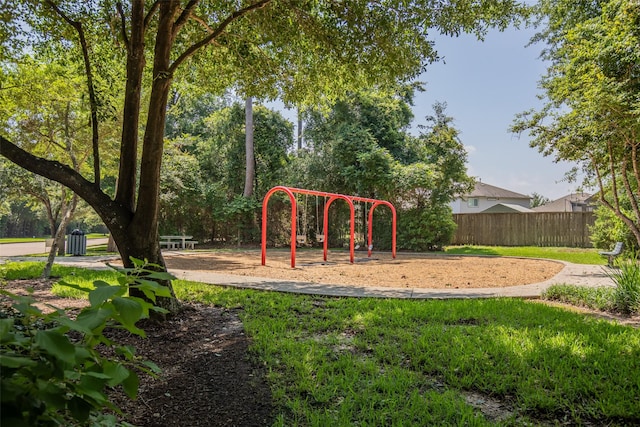 community jungle gym featuring fence