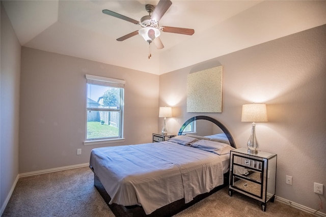 carpeted bedroom with baseboards and ceiling fan