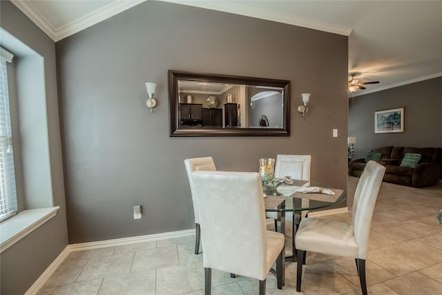 dining room with tile patterned flooring, baseboards, ceiling fan, and ornamental molding