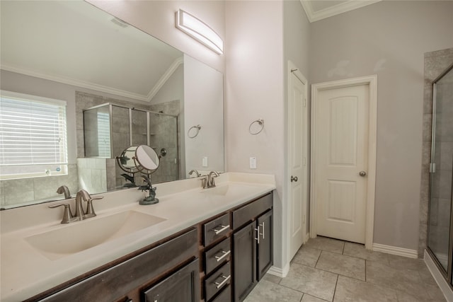 full bathroom with ornamental molding, a stall shower, and a sink