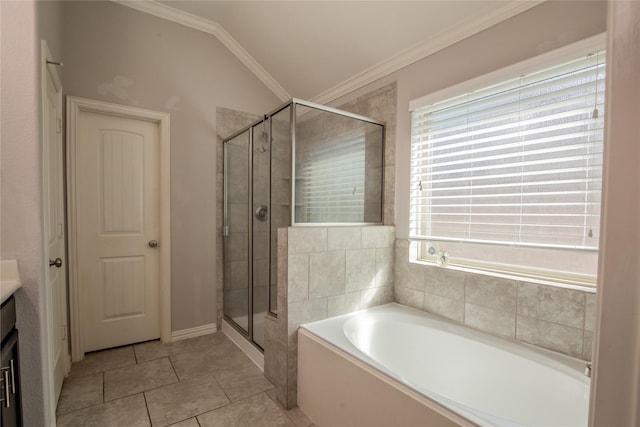 full bathroom featuring lofted ceiling, a shower stall, crown molding, a bath, and tile patterned floors