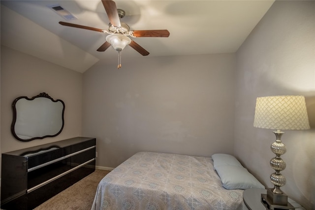 bedroom featuring visible vents, ceiling fan, carpet flooring, and vaulted ceiling