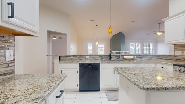 kitchen featuring a sink, a wealth of natural light, decorative backsplash, and dishwasher