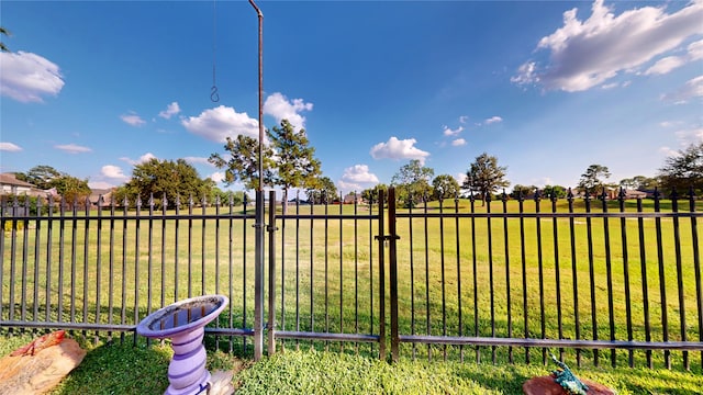 view of yard featuring a gate and fence